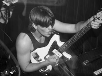 Man playing electric guitar