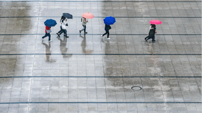 Photo Courtesy of wal_172619 on Pixabay Four people walking in the rain
