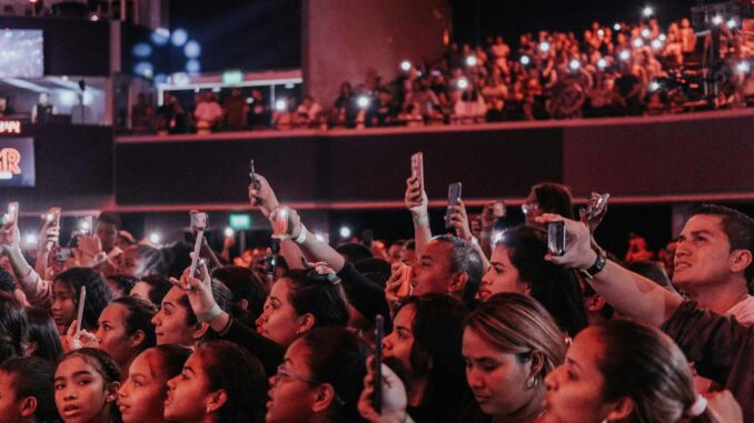 pexels-jibarofoto-3689546 Fans filming concert