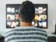 Man watching TV in living room
