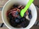 Frozen Yoghurt and berries in paper bowl
